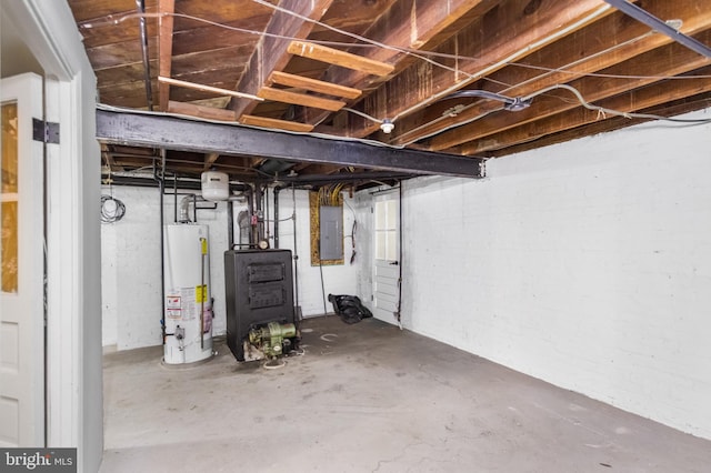 basement with electric panel and water heater