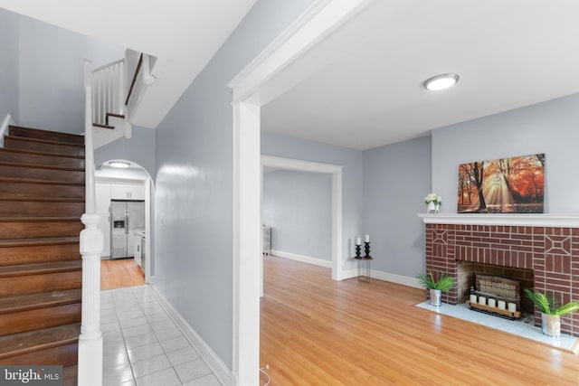 hall with light tile patterned floors