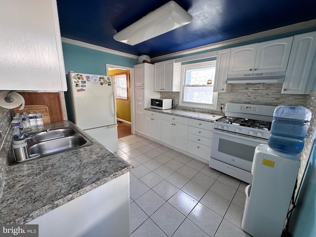 kitchen featuring white appliances, light tile patterned flooring, sink, white cabinets, and ornamental molding