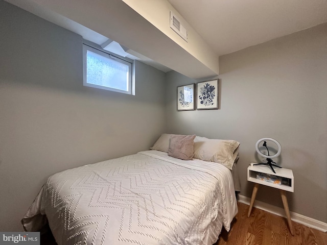 bedroom featuring hardwood / wood-style floors