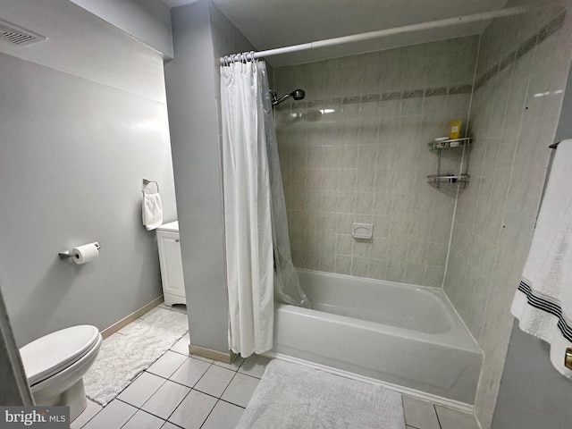 full bathroom featuring vanity, shower / bath combo with shower curtain, toilet, and tile patterned flooring