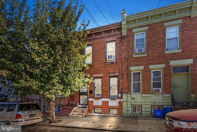 view of front of property featuring cooling unit