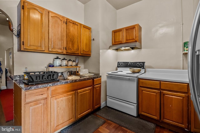 kitchen featuring white range with electric stovetop, dark parquet floors, and stainless steel fridge with ice dispenser