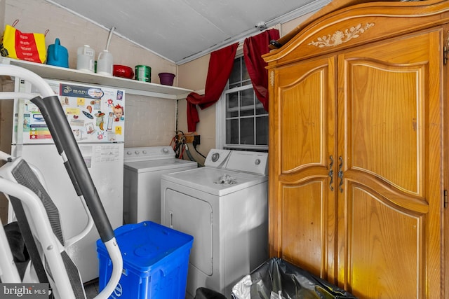 clothes washing area featuring independent washer and dryer