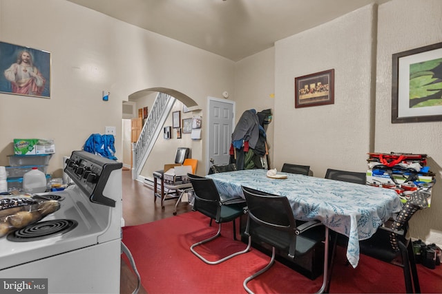 dining space featuring wood-type flooring and washer / clothes dryer