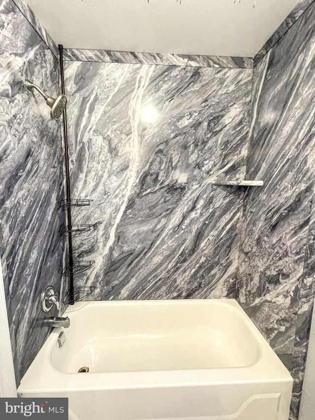 bathroom with a tub to relax in