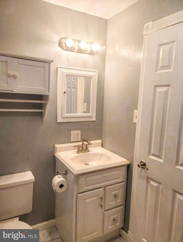 bathroom with vanity and toilet