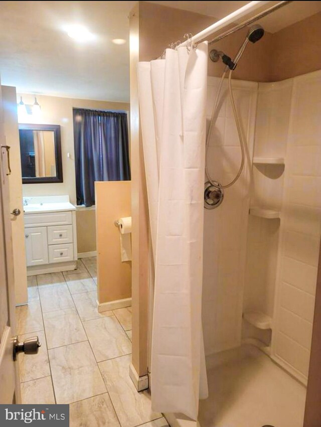 bathroom featuring vanity and a shower with curtain