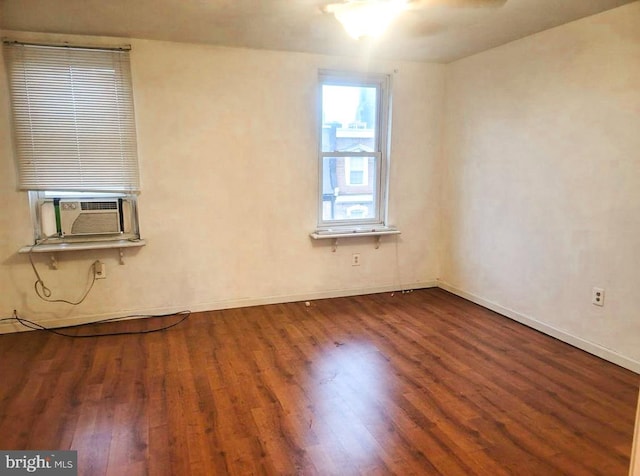 unfurnished room with wood-type flooring and cooling unit