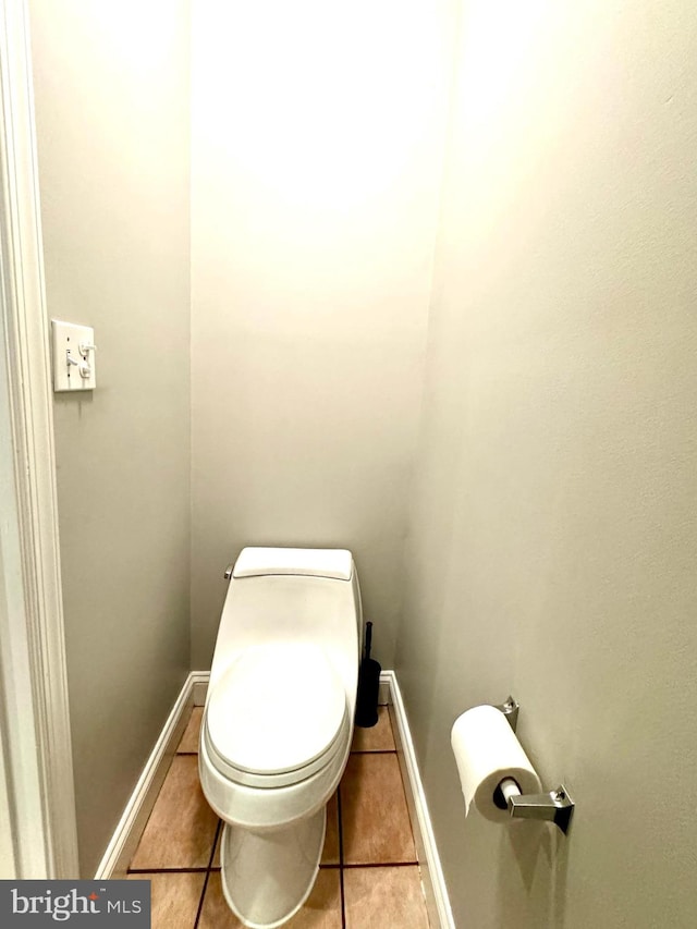 bathroom featuring tile patterned floors and toilet