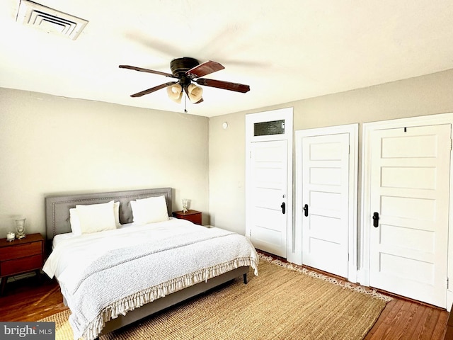 bedroom featuring hardwood / wood-style flooring and ceiling fan