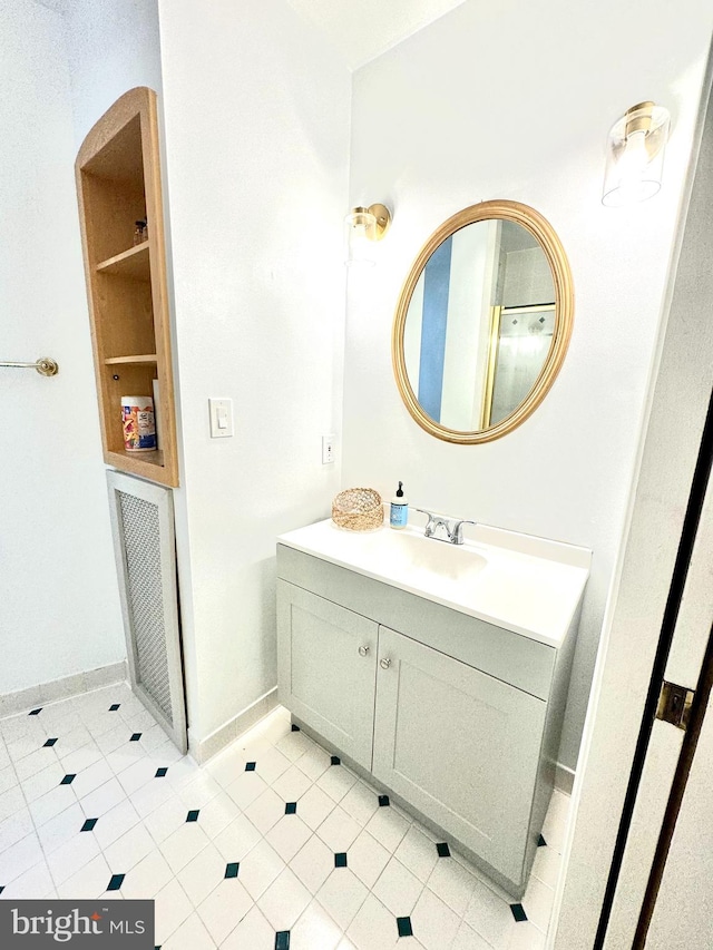 bathroom with vanity and tile patterned flooring