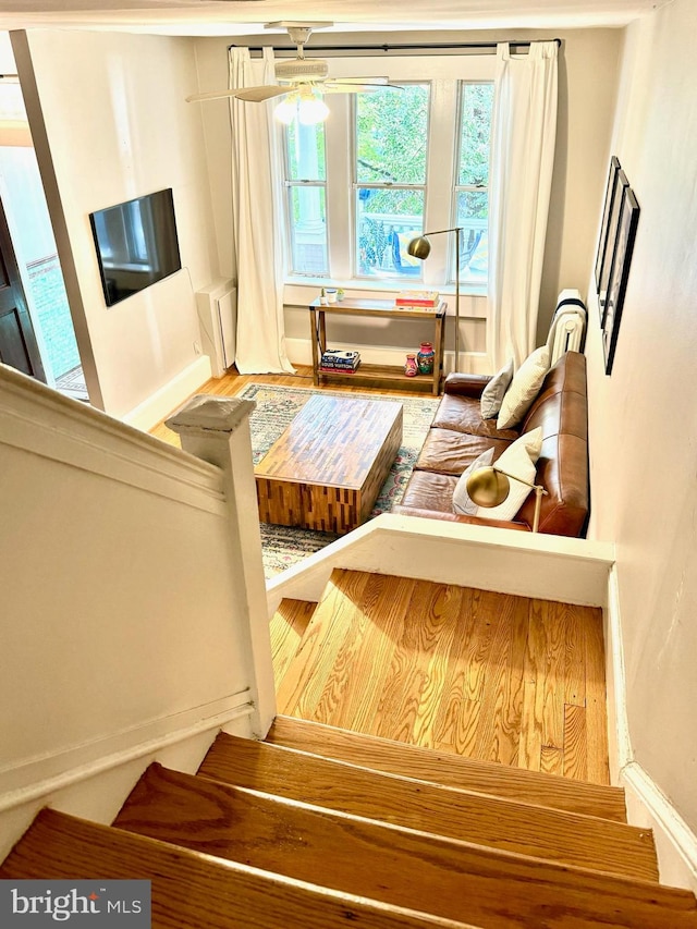 sitting room featuring ceiling fan