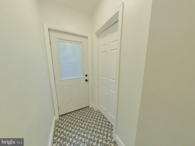 entryway with light tile patterned floors