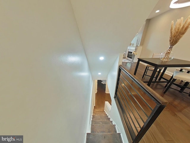 stairs with wood-type flooring