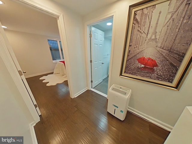 corridor featuring dark hardwood / wood-style flooring