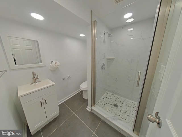 bathroom with toilet, an enclosed shower, vanity, and tile patterned floors