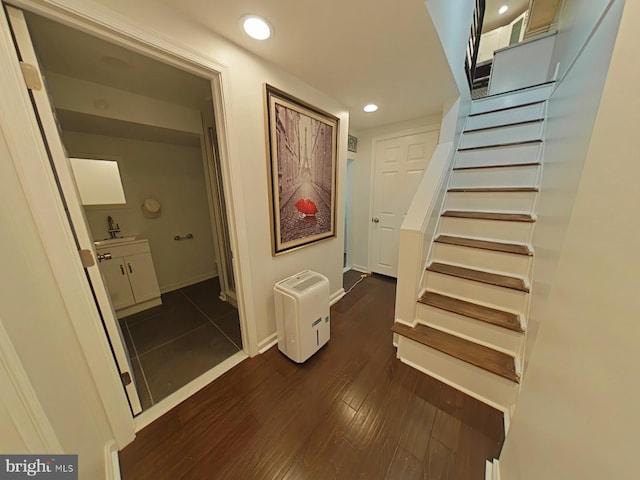 stairway featuring hardwood / wood-style floors