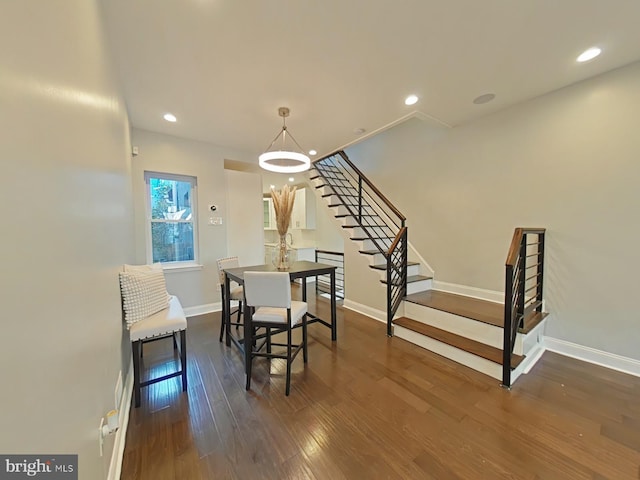 dining room with dark hardwood / wood-style flooring