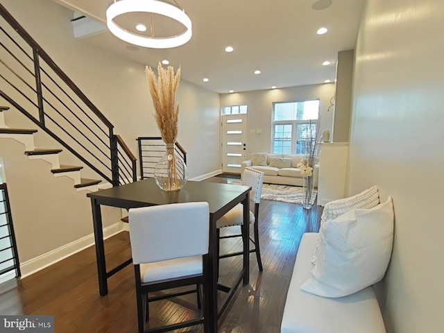 dining space featuring dark hardwood / wood-style flooring