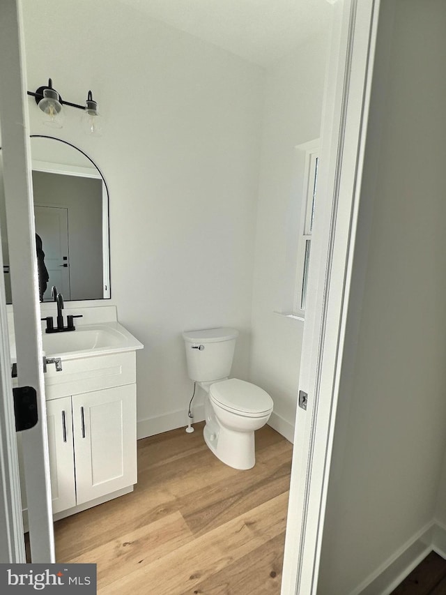 LOT9 Fortuna Dr, Hatfield, PA 19440 - bathroom featuring wood finished floors, vanity, toilet, and baseboards