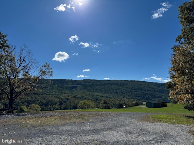 view of mountain feature featuring a view of trees