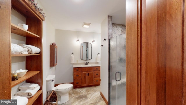 bathroom with toilet, marble finish floor, a shower stall, and vanity