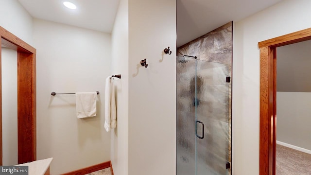 bathroom with a stall shower, recessed lighting, and baseboards