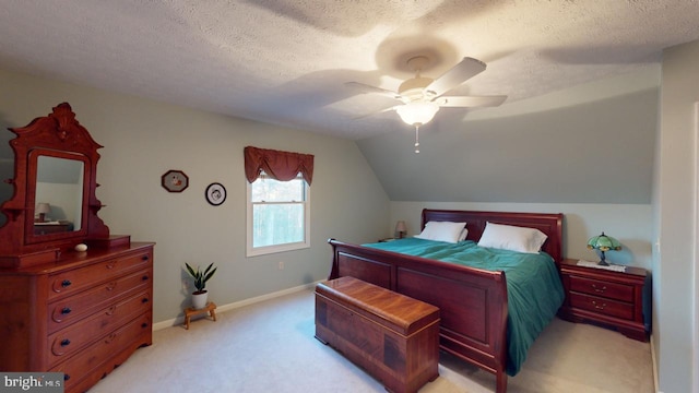 bedroom featuring lofted ceiling, ceiling fan, a textured ceiling, light colored carpet, and baseboards