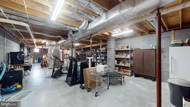 unfinished basement featuring heating unit