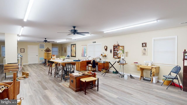 interior space with light wood-style flooring and baseboards