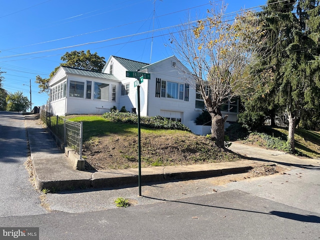 view of front of property with a sunroom