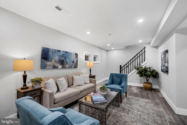 living room with dark hardwood / wood-style floors