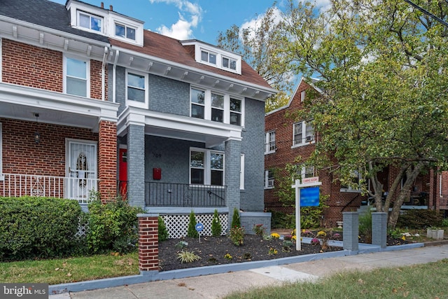 multi unit property featuring a porch