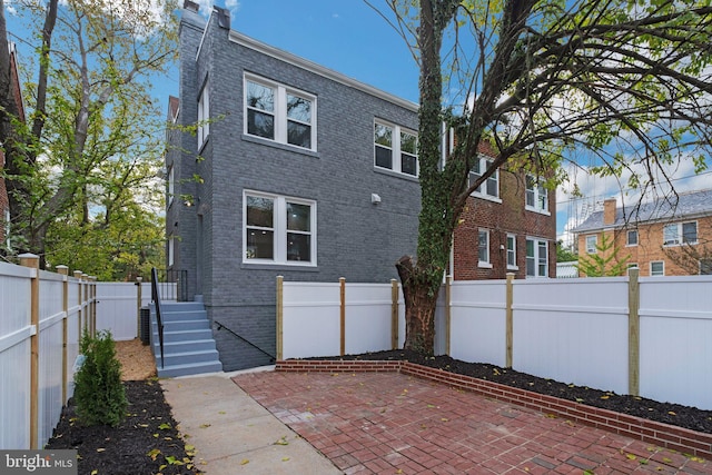 back of house with a patio