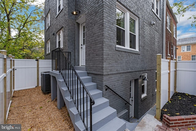 view of side of property featuring central AC unit