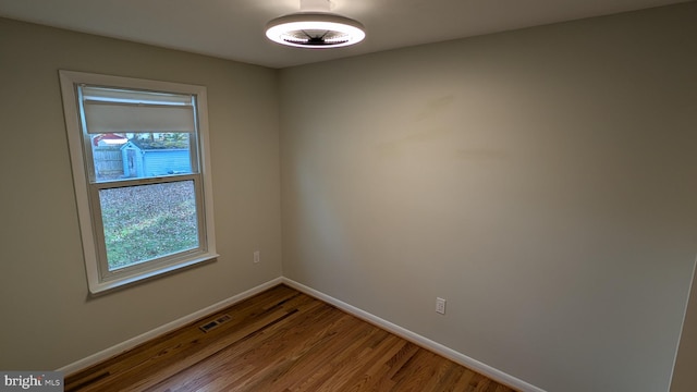 spare room featuring hardwood / wood-style flooring