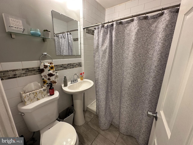 bathroom with toilet, tile walls, walk in shower, and tile patterned flooring