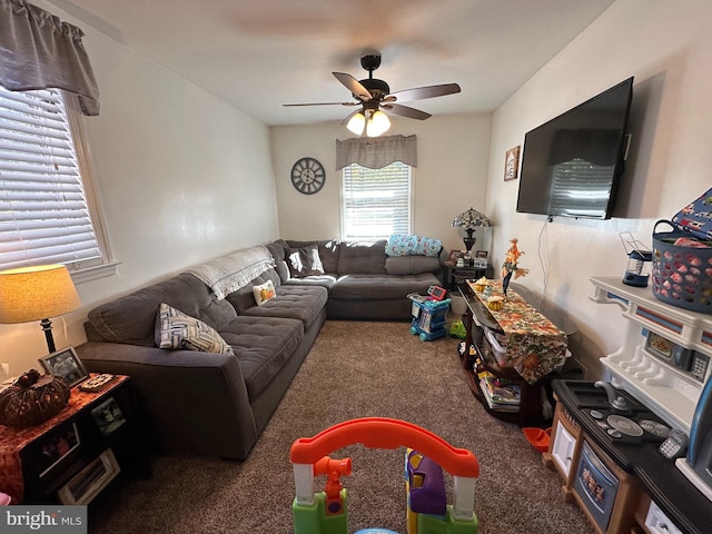 living room featuring carpet flooring and ceiling fan