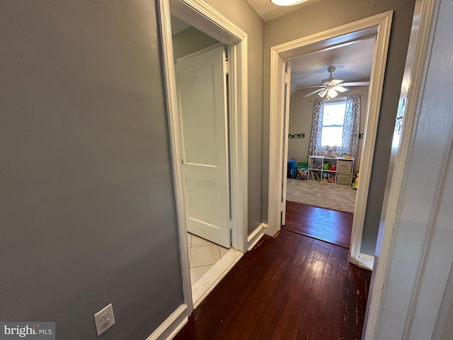 hall with wood-type flooring