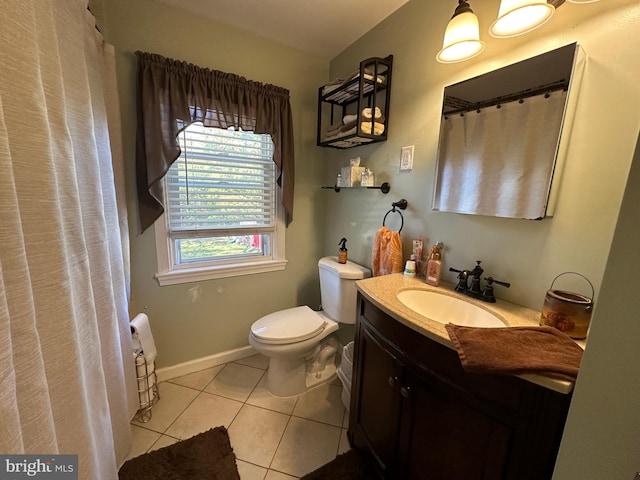 bathroom featuring vanity, toilet, and tile patterned flooring