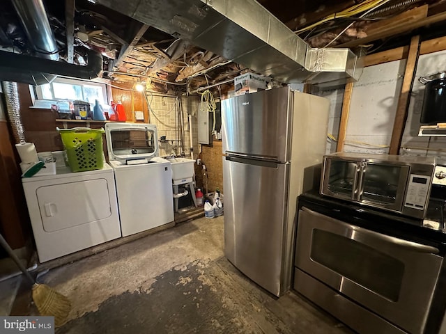 basement featuring independent washer and dryer, stainless steel fridge, electric panel, and sink