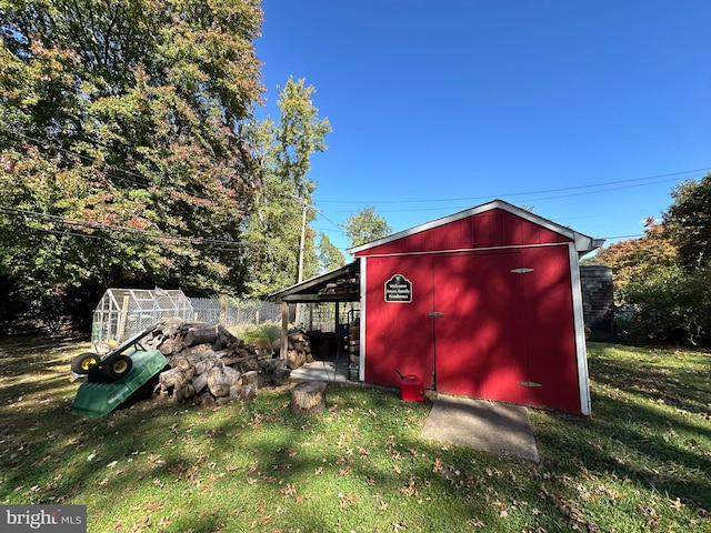 view of outdoor structure with a lawn