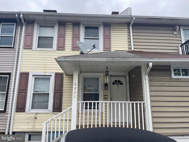 view of exterior entry featuring a porch