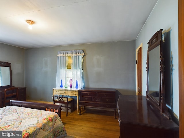 bedroom with wood-type flooring