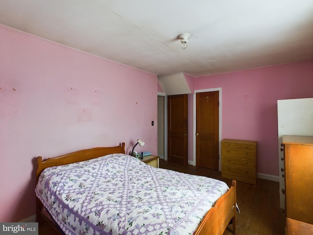 bedroom featuring dark wood-type flooring