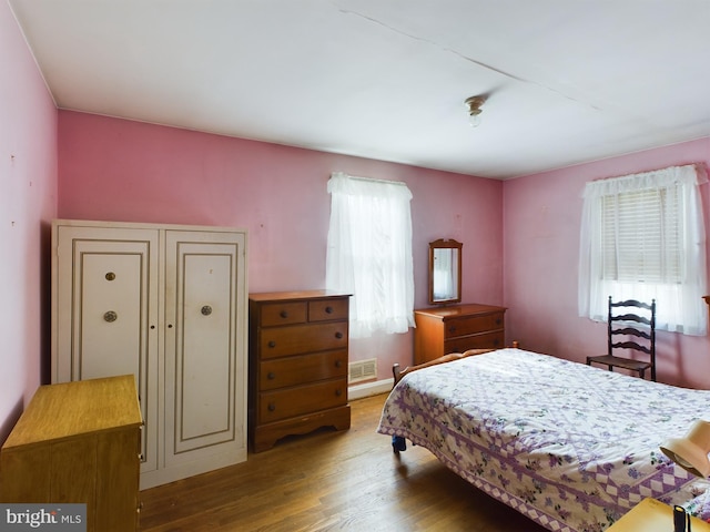 bedroom featuring wood-type flooring