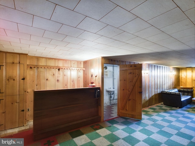 unfurnished bedroom with wood walls