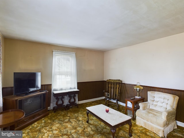 living room with wood walls