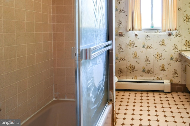 bathroom with a baseboard heating unit and wallpapered walls
